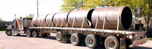 A truck shipping steel drums